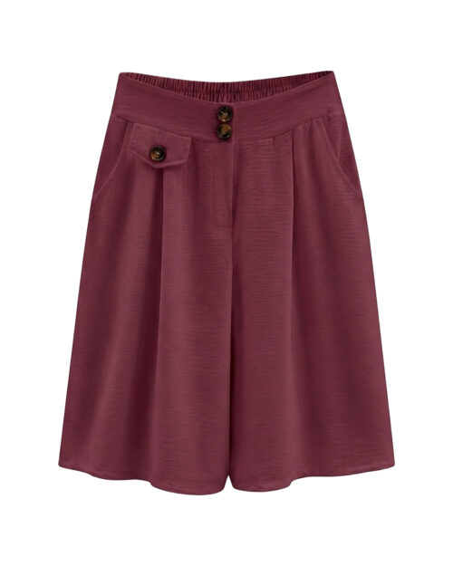 Bermuda Capri: falda pantalón de diario color burdeos en viscosa fluida elástica con bolsillos, botones decorativos de carey y cinturilla trasera elástica de Quiles_Shop.