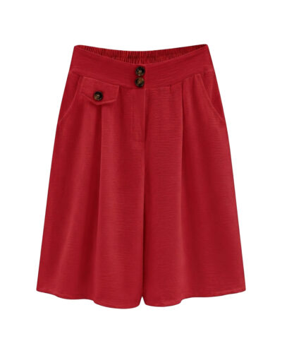 Bermuda Capri: falda pantalón de diario color rojo en viscosa fluida elástica con bolsillos, botones decorativos de carey y cinturilla trasera elástica de Quiles_Shop.
