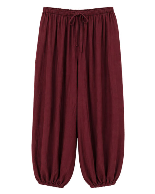 Pantalón Bombacho Harem: pantalón de color burdeos en viscosa fluida de efecto arrugado, cintura elástica, bolsillos y tobillos fruncidos de Quiles_Shop.
