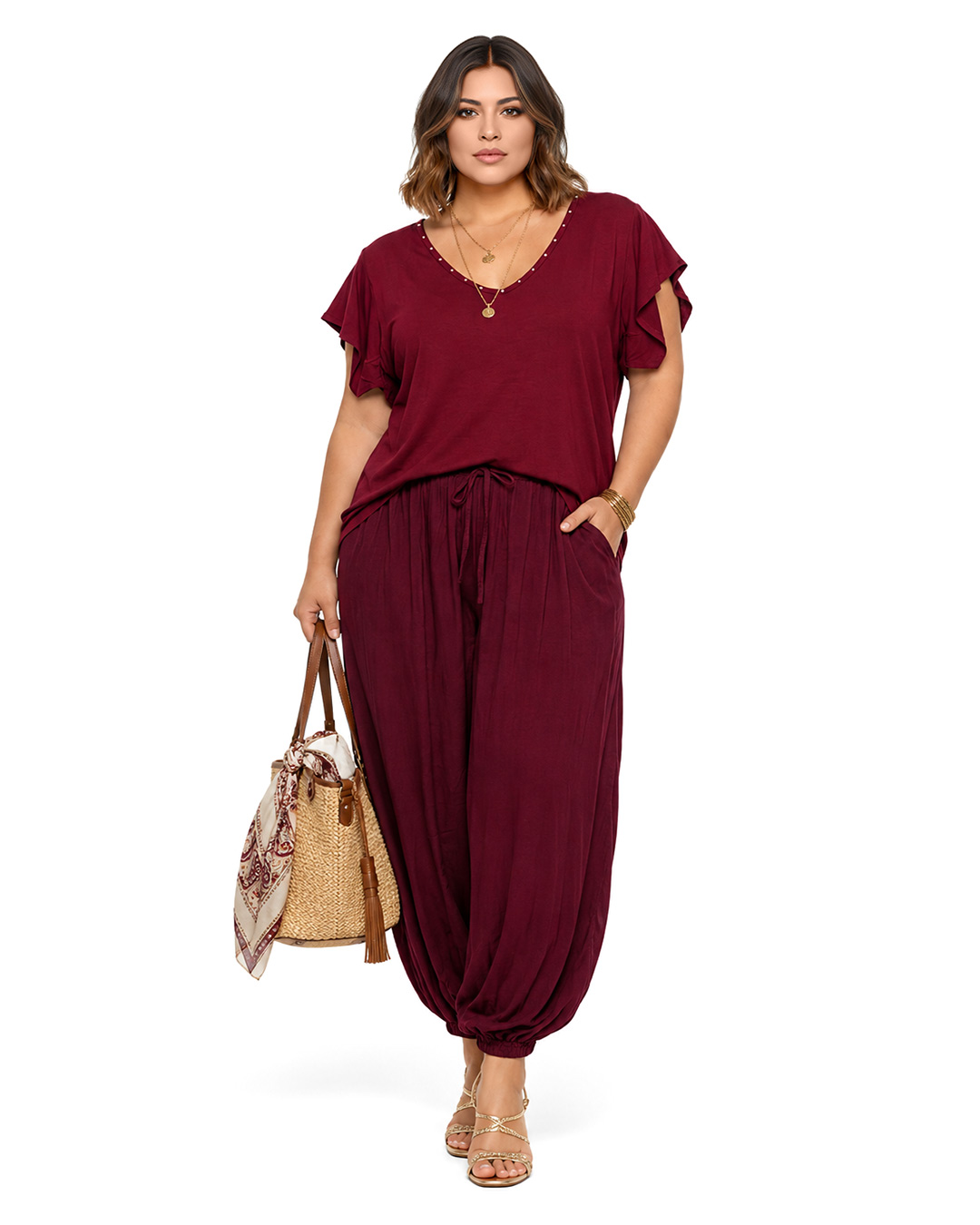 Pantalón Bombacho Harem: pantalón de color burdeos en viscosa fluida de efecto arrugado, cintura elástica, bolsillos y tobillos fruncidos de Quiles_Shop.