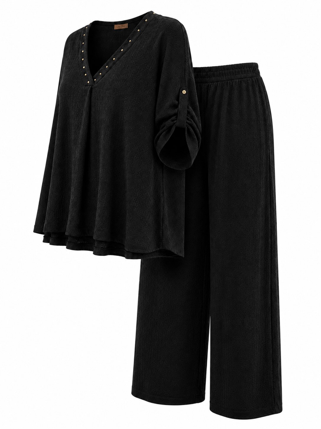 blusa y pantalón ancho texturizado negro con cintura elástica