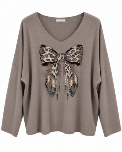 Jersey lazo topo con animal print, plumas y detalles de pedrería