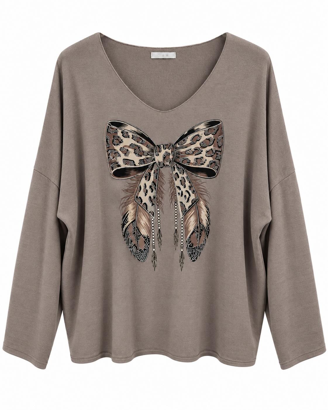 Jersey lazo topo con animal print, plumas y detalles de pedrería