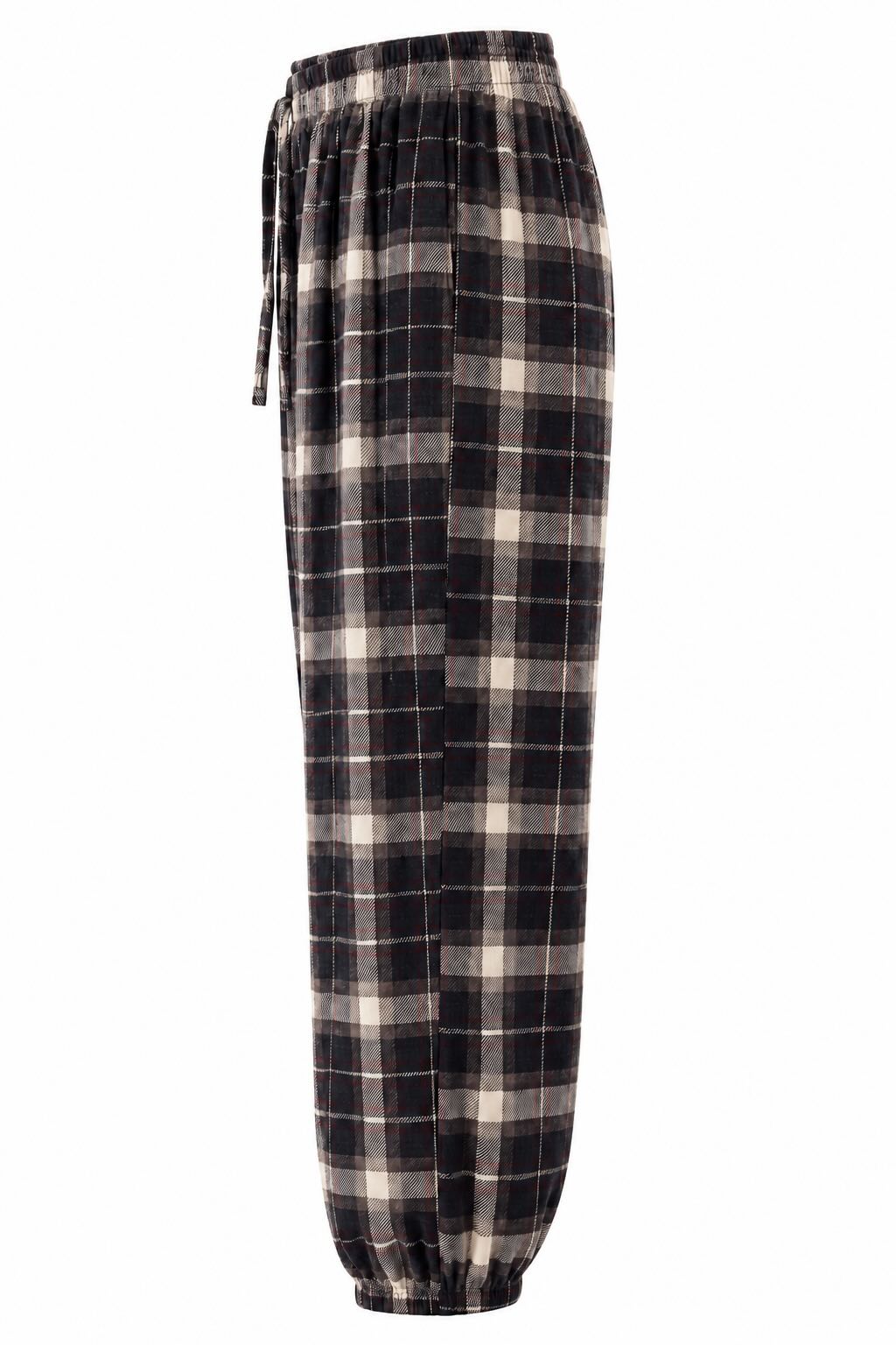 Lateral pantalón marrón de cuadros escoceses con cintura y bajos elásticos.