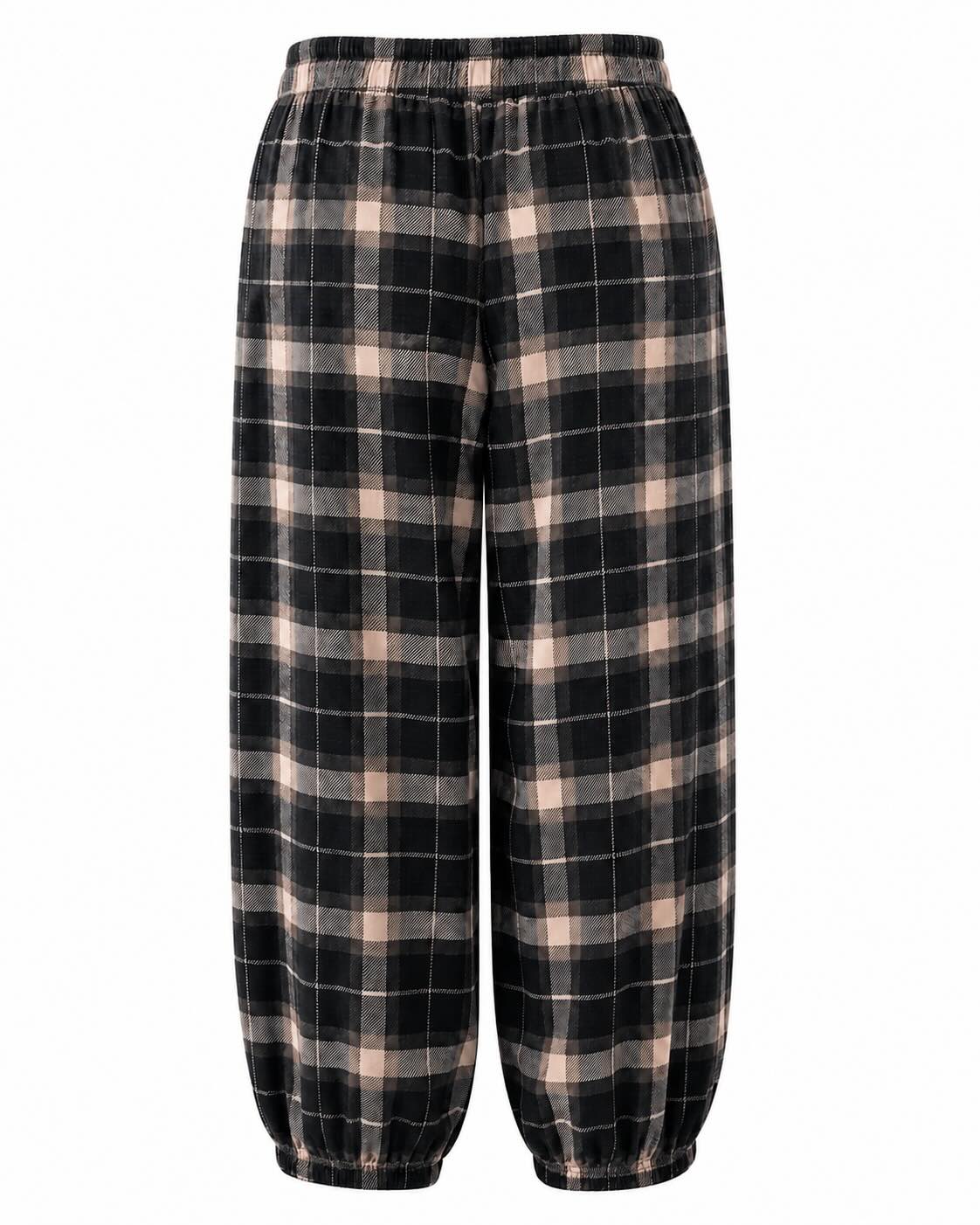 Espalda pantalón negro de cuadros escoceses con cintura y bajos elásticos.